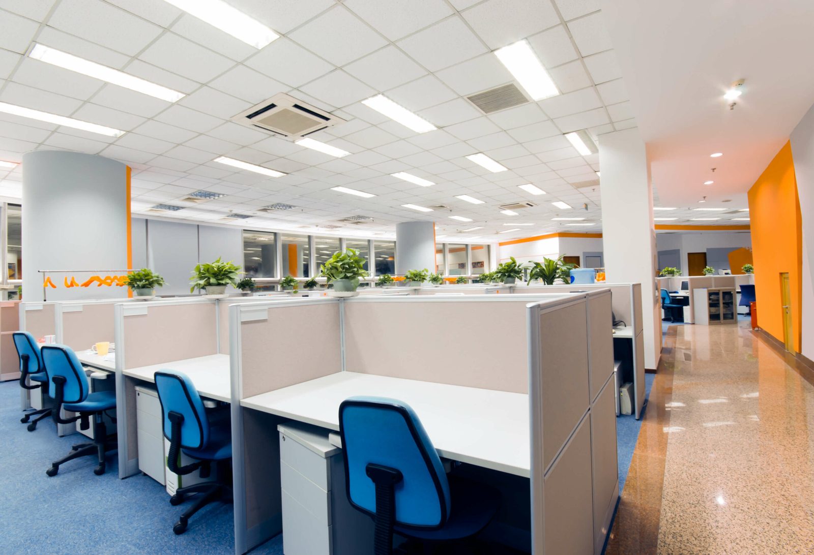 Open-plan office workstations cleaned and ready before the workday